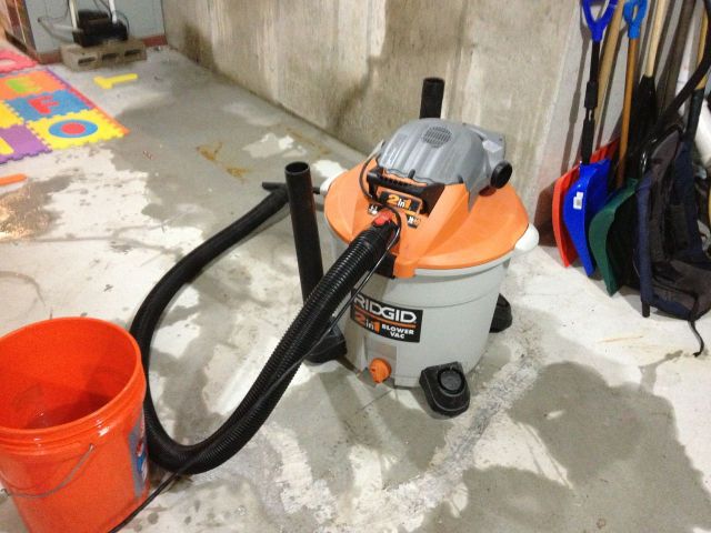 16 gallon capacity with caster wheels and a discharge spout at the bottom