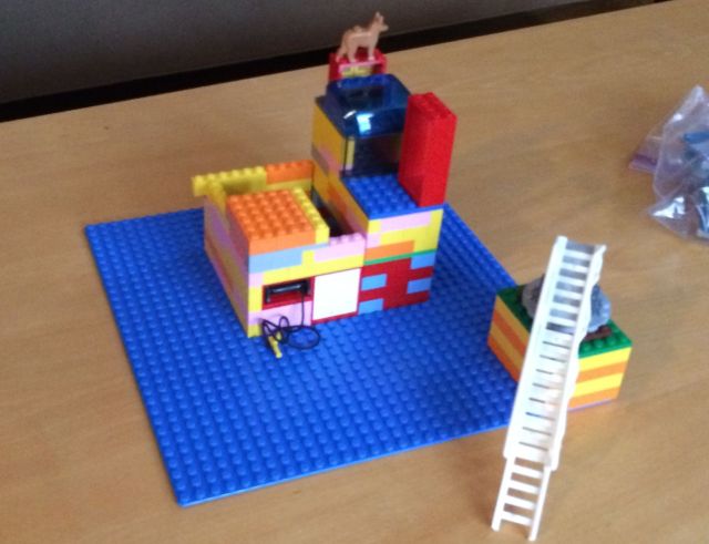 A fire engine ladder becomes a boarding ramp to a larger building